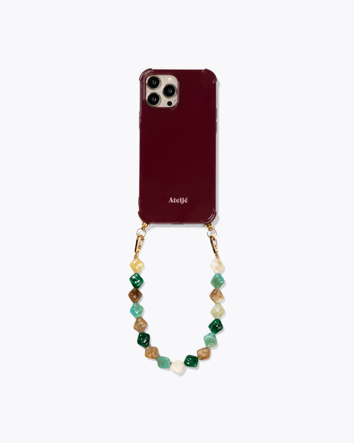 Bold burgundy recycled case with Spill the tea cord