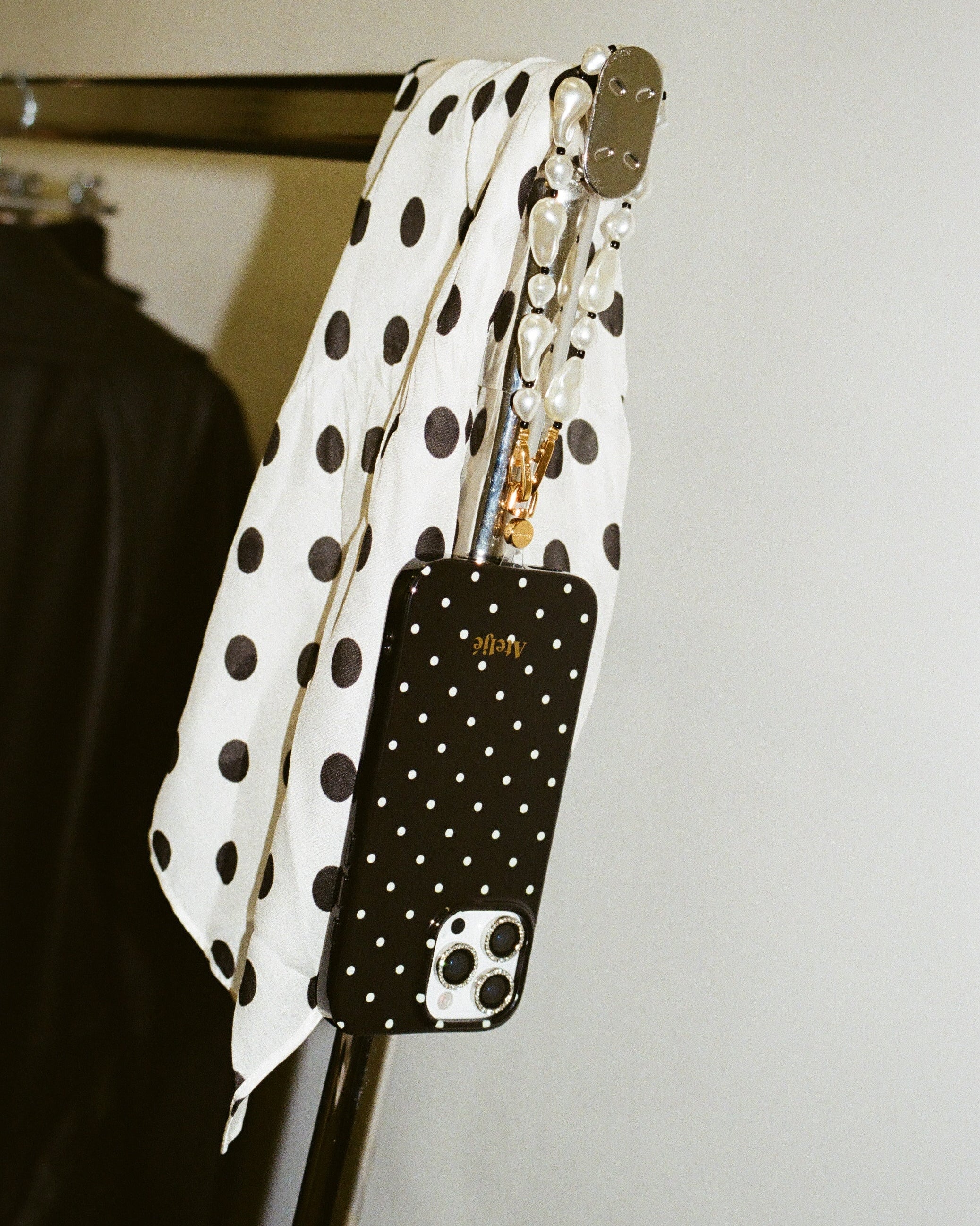 Black polkadot case with The noir cord