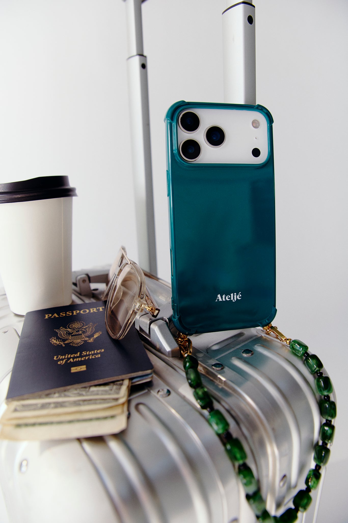 Teal case with Touch grass cord